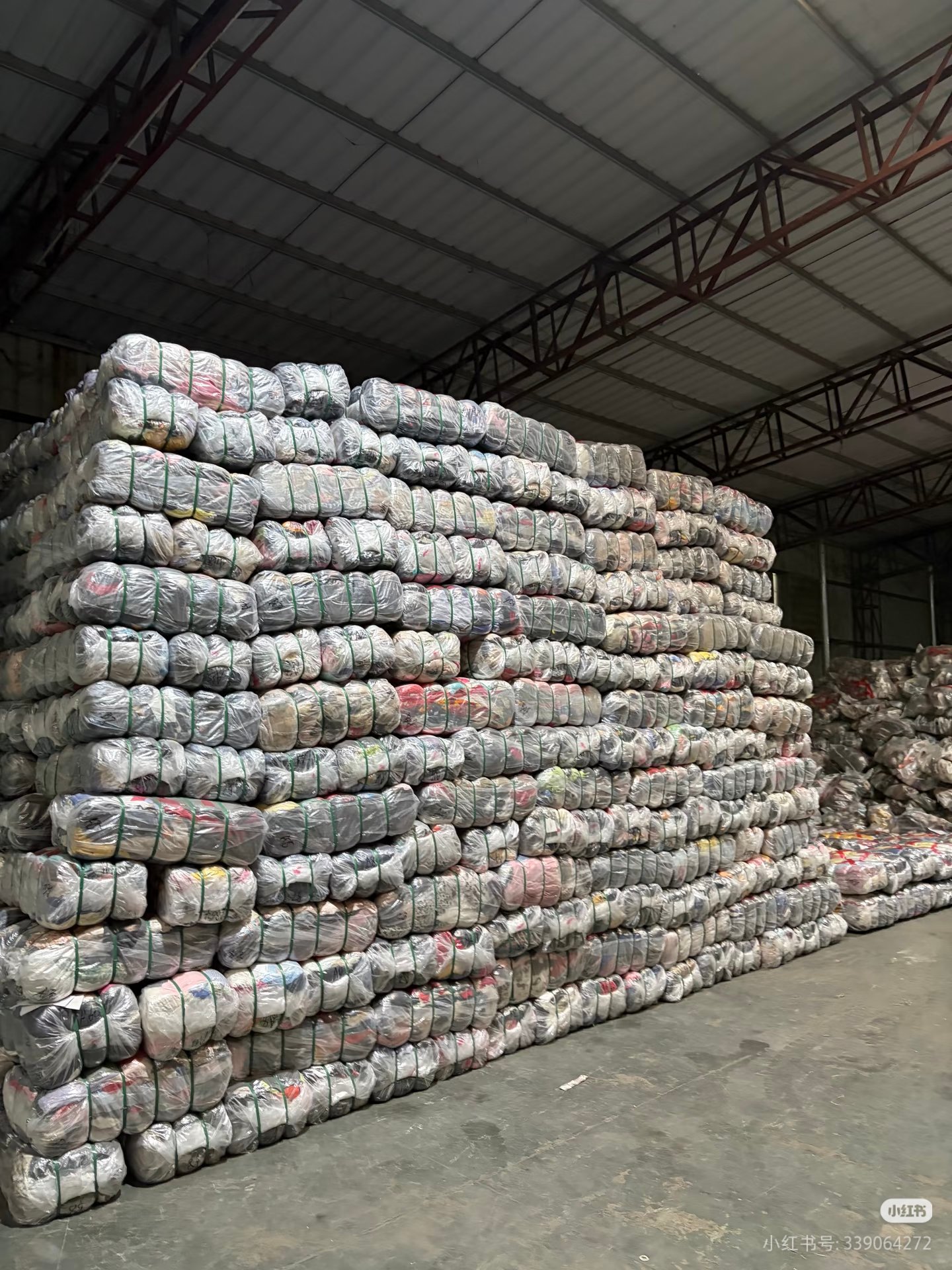 Stacked used clothing bales